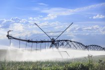 Center pivot irrigation in field near Lethbridge, Alberta, Canada — Stock Photo