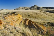 Sole illuminato paesaggio roccioso, Grasslands National Park — Foto stock