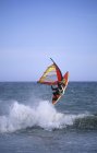 Windsurfer jumping off wave at Victoria waterfront, Vancouver Island, British Columbia, Canada. — Stock Photo