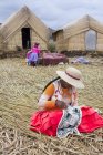 Local residents of floating reed islands of Uros, Lake Titicaca, Peru — Stock Photo