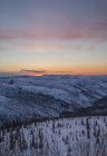 Sunset clouds over forest and meadow of Dawson City, Yukon. — Stock Photo
