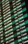 Timetable on departure board at airport, close-up — Stock Photo