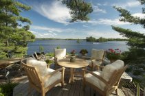 Dining table at lounge by Kahshe Lake, Muskoka, Ontario — Stock Photo