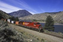 Freight train at Spences Bridge beside Thompson River, British Columbia, Canada. — Stock Photo
