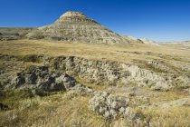 Scenic view of hill under blue sky, Grasslands National Park — Stock Photo