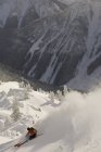 Skier making some powder turn in backcountry of Kicking Horse Resort, Golden, British Columbia, Canada — Stock Photo