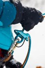 Close-up of woman belaying while ice climbing with equipment — Stock Photo