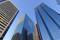 Low angle view of skyscrapers of downtown with reflection, TransCanada Tower, Calgary, Alberta, Canada — Stock Photo