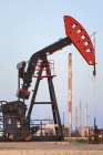 Oil pump jack and natural gas plant, Bakken Oil field, Glen Ewen, Saskatchewan, Canada — Stock Photo