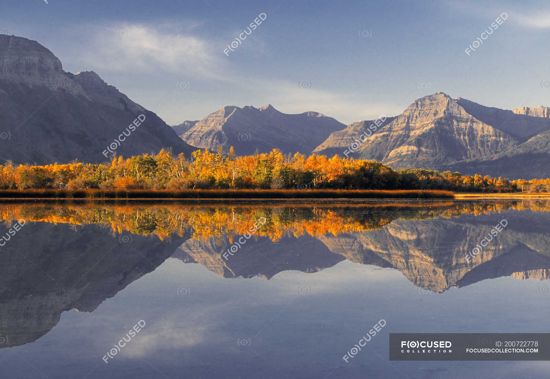 Maskinonge Lake with mountains reflection in Waterton Lakes National ...