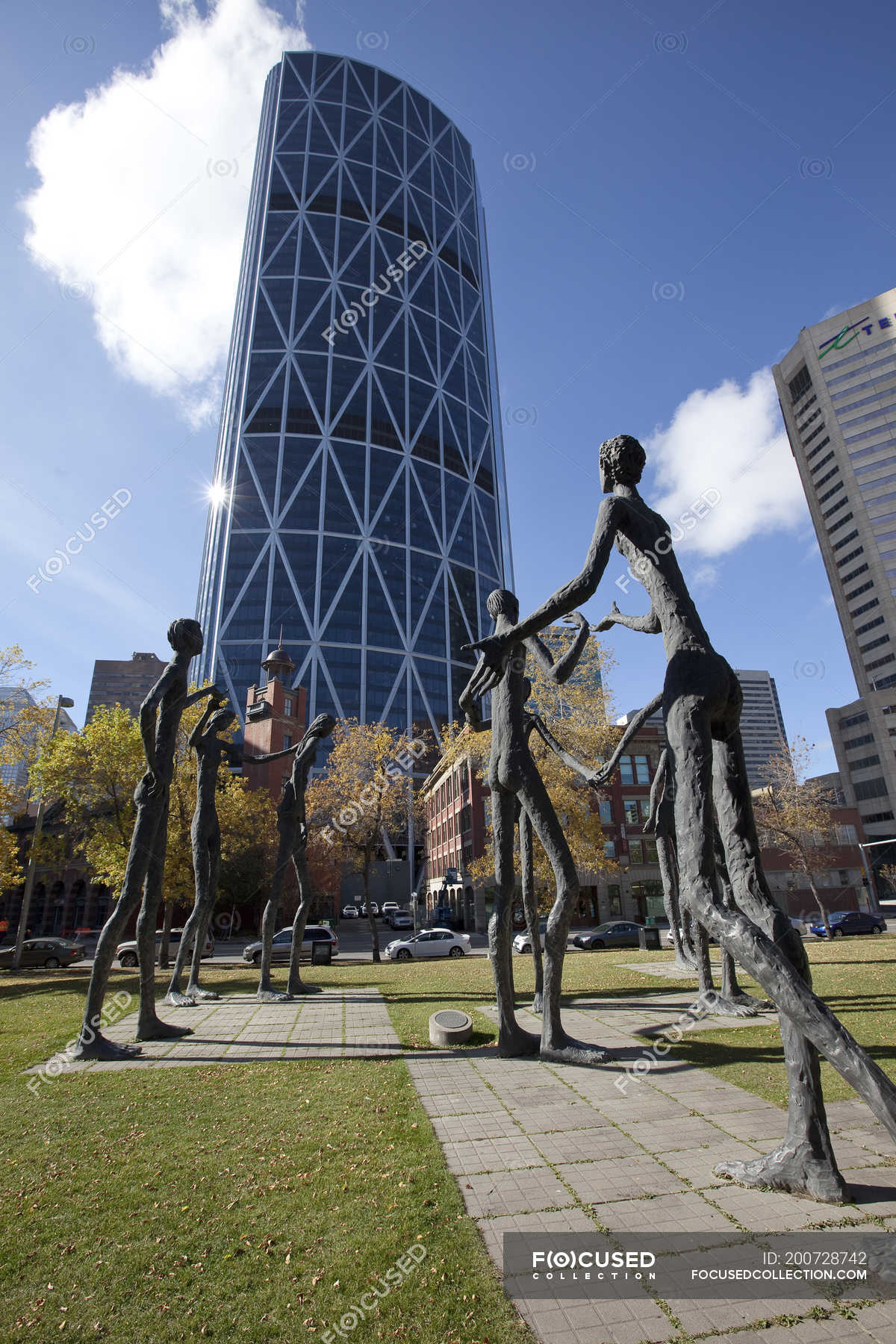 Family Of Man Sculptures Against Modern Building In Calgary Alberta   Focused 200728742 Stock Photo Family Man Sculptures Modern Building 