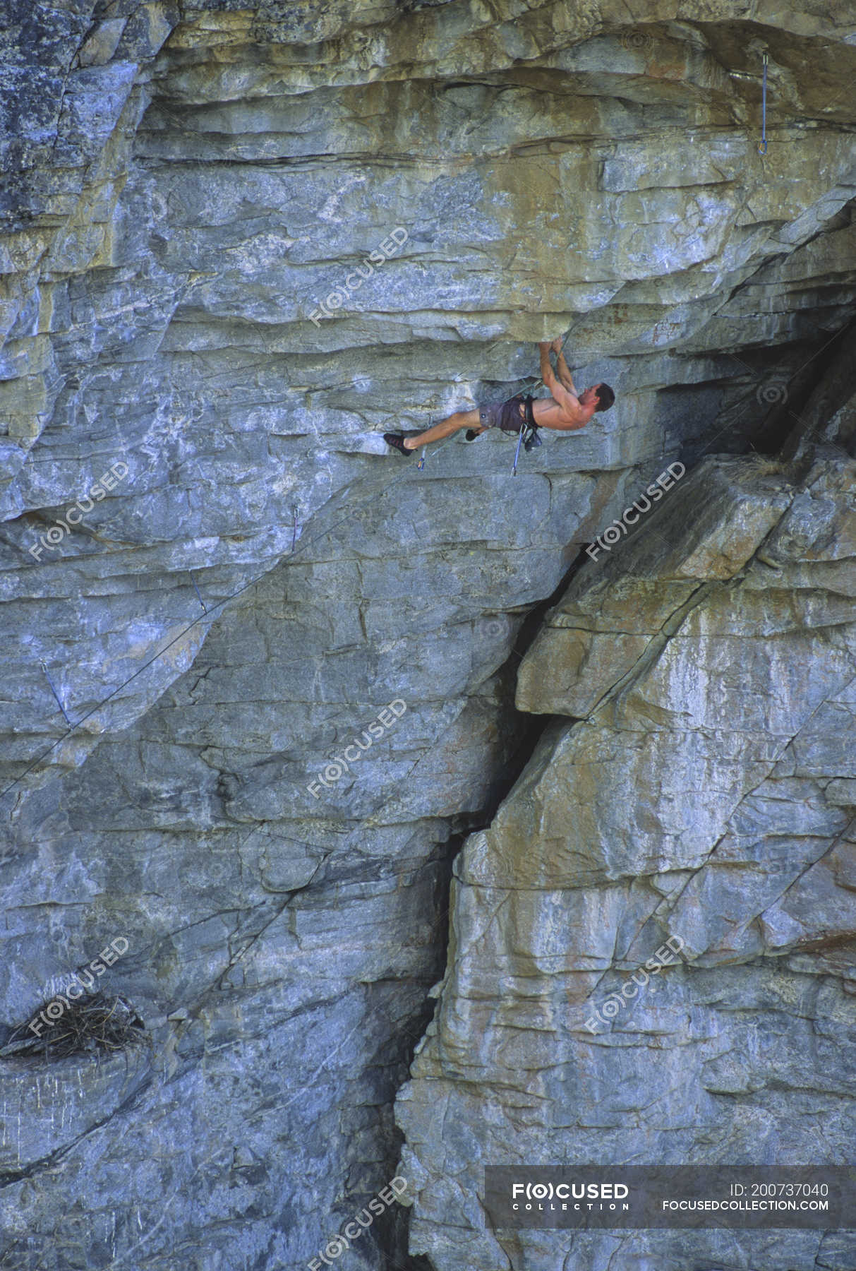 Rock climber climbing rock in Grand Canyon at Skaha Bluffs, Penticton