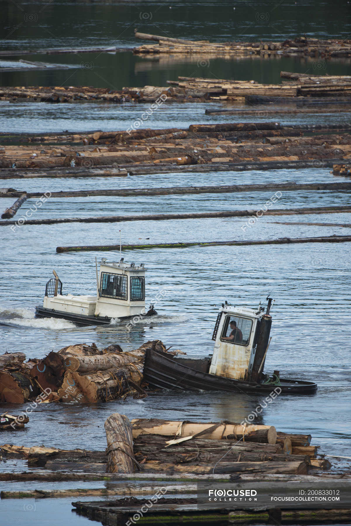 Logging boom boats at coastal village of Beaver Cove, Kokish River