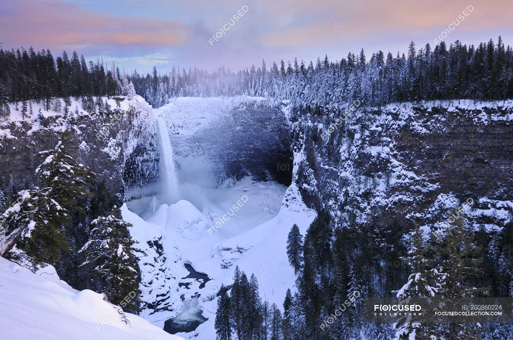 Helmcken Falls in winter with accumulated snow ice cone, Wells Gray