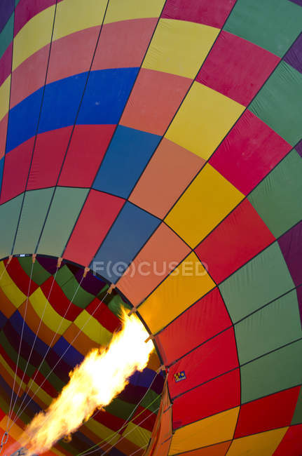 Ballooning burner flame heating hot air balloon, full frame. — Stock Photo