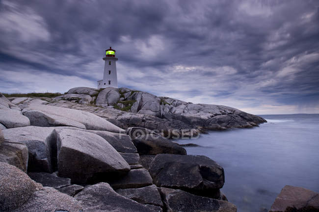 Lighthouse at Peggy Cove during approaching storm, Nova Scotia, Canada. — Stock Photo