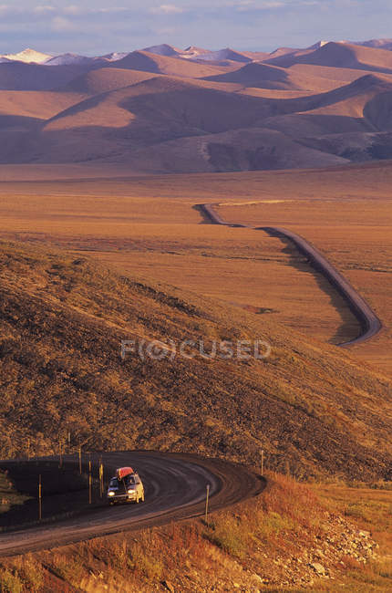 Truck riding on Dempster Highway by Richardson Mountains, Yukon, Canada. — Stock Photo