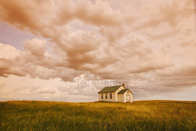 Old church in meadow near Val Marie, Saskatchewan, Canada — Stock Photo