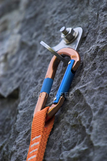 Quickdraw climbing equipment on rock, close-up — Stock Photo