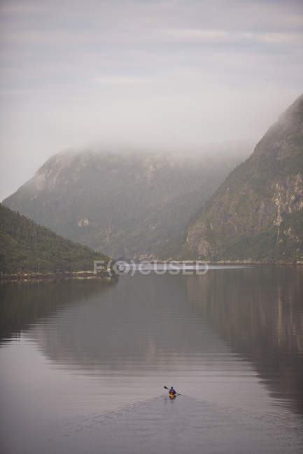 Kayaker heading out into Grey River, Newfoundland, Canada. — Stock Photo