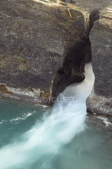 Flowing water of Kicking Horse River at Natural Bridge, Yoho National Park, British Columbia, Canada — Stock Photo