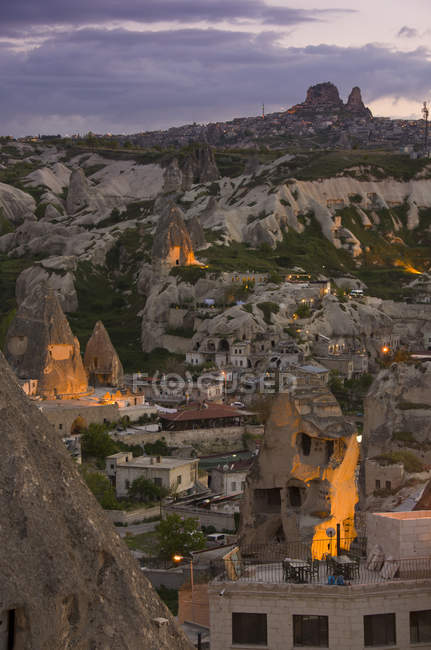 Townscape and fairy chimneys of Goreme at sunset, Cappadocia, Turkey — Stock Photo