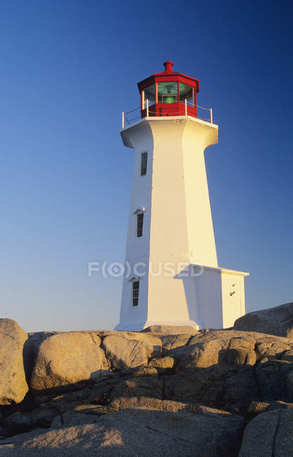 Low angle view of Peggy Cove lighthouse in Nova Scotia, Canada — Stock Photo