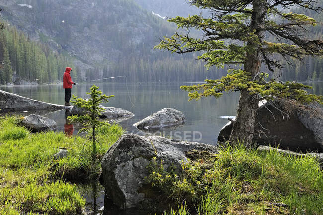 Fisherman fishing in Quiniscoe Lake, Cathedral Provincial Park, Okanagan Region, British Columbia, Canada — Stock Photo