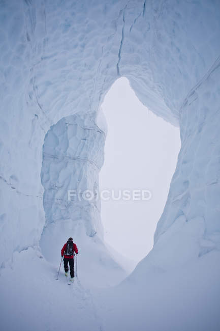 Male backcountry skier skiing through glacier, Icefall Lodge, Golden, British Columbia, Canada — Stock Photo