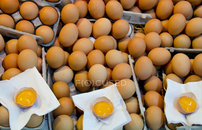 Eggs with samples at organic farm market. — Stock Photo