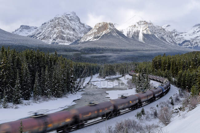 Riding train at Morants curve of mountains of Banff National Park, Alberta, Canada — Stock Photo