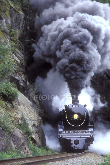 Royal Hudson steam train emerging from tunnel, British Columbia, Canada. — Stock Photo