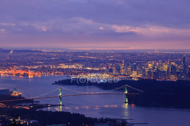 Vancouver skyline with Lion Gate Bridge and Burrard Inlet at dawn, British Columbia, Canada. — Stock Photo