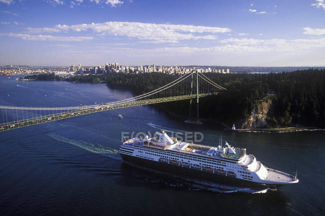 Aerial view of cruise ship passing under Lions Gate Bridge, Vancouver, British Columbia, Canada. — Stock Photo