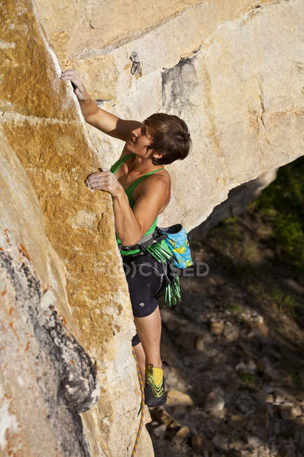 A strong female climber works on Supernatural zombie suspense thriller 11d, Silver City, Castle Mtn, Banff, AB — Stock Photo