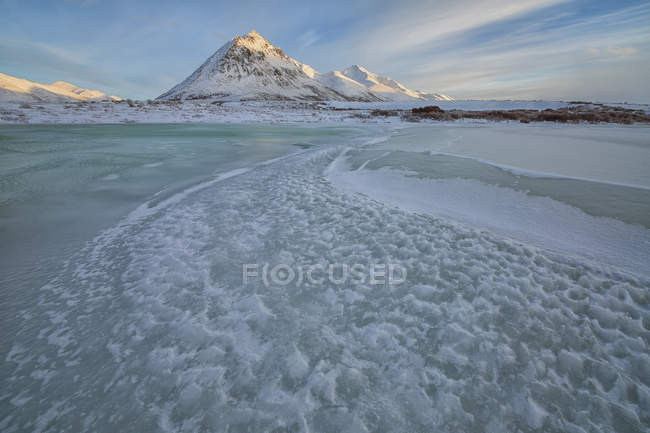 Frozen Blackstone River with Angelcomb Peak by Dempster Highway, Yukon. — Stock Photo