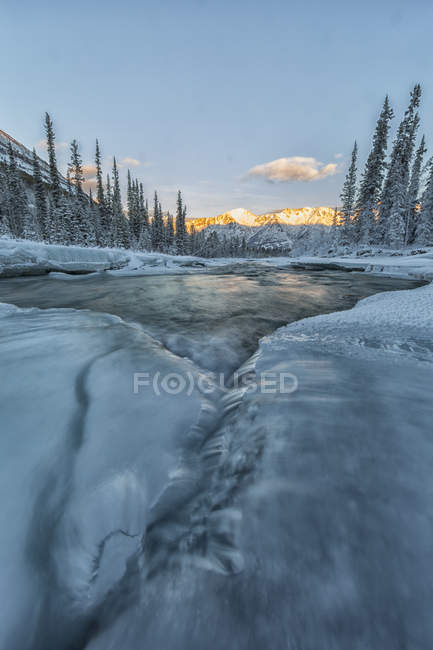 Sunlight on Gray Ridge with Wheaton River flowing towards Bennett Lake, Yukon. — Stock Photo