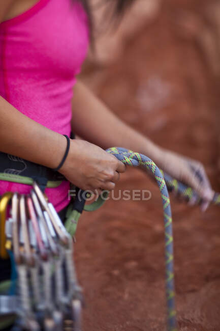 Close-up of woman tying rope before rock climbing in St Georges, Utah, United States of America — Stock Photo