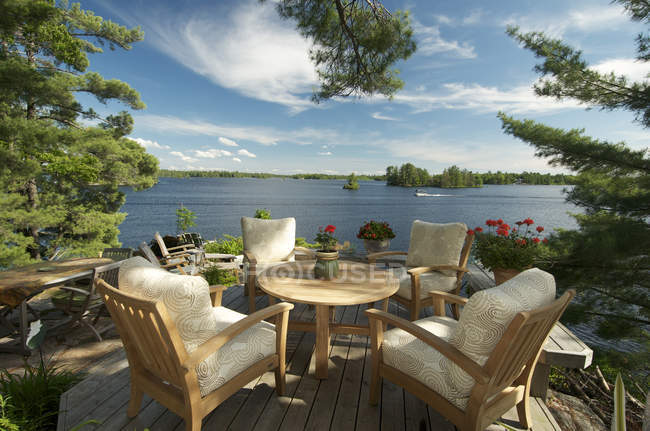 Dining table at lounge by Kahshe Lake, Muskoka, Ontario — Stock Photo