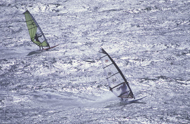 High angle view of two male windsurfers against water, Victoria, Vancouver Island, British Columbia, Canada. — Stock Photo