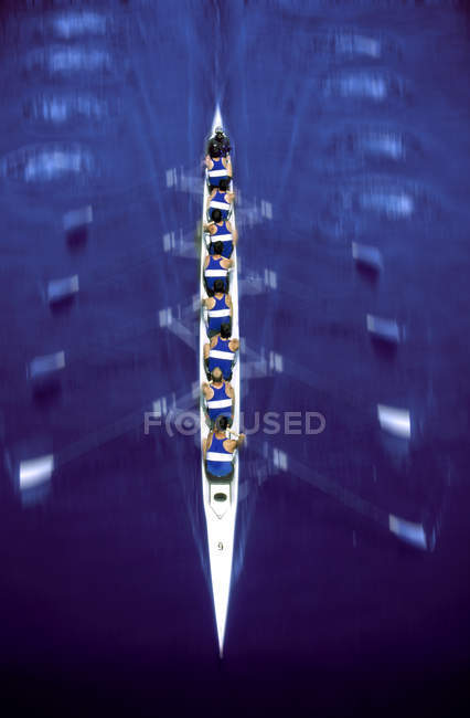 Men in eight rowing skull, motion blur — Stock Photo