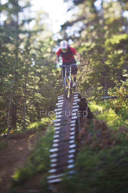 A young man in a rush to get down Moose Mountain, Kananaskis, Calgary, Alberta, Canada. — Stock Photo