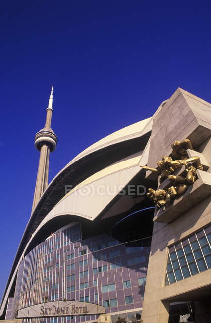 Low angle view of Skydome Hotel with CN Tower, Toronto, Ontario, Canada. — Stock Photo