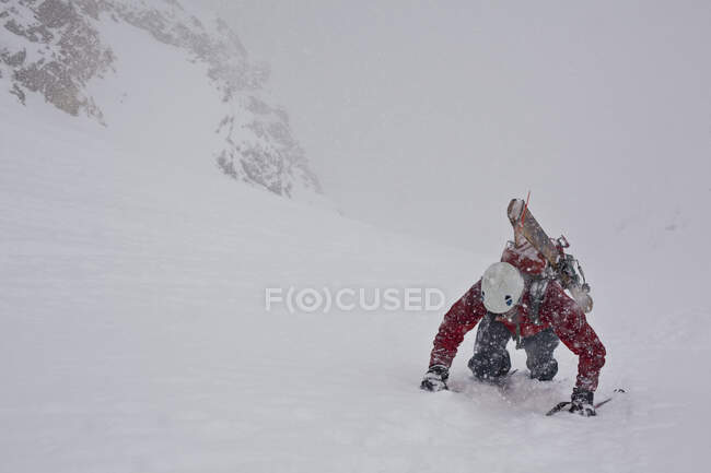 Man bootpacking at Aemmer coulior on Mount Temple, Lake Louise, Banff National Park, Alberta, Canada — Stock Photo