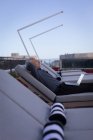 Businessman resting on a sun lounger in hotel premises — Stock Photo