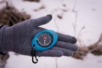 Close-up of woman hand holding compass — Stock Photo