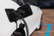 Close-up of electric car being charged at charging station — Stock Photo