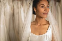 Sensual mixed-race bride in wedding dress and veil — Stock Photo