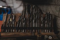 Close-up of drill bits arranged in workshop — Stock Photo