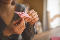 Close-up of woman preparing a paper craft at home — Stock Photo